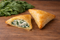 Puff pastry pie with spinach and cream cheese